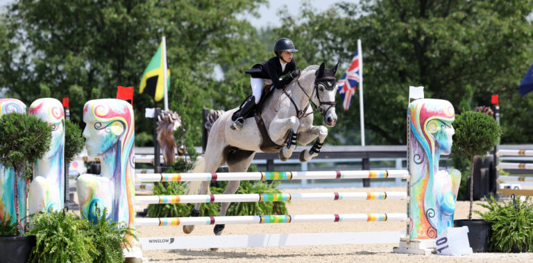 Equestrian Dakota Zehler and horse jumping
