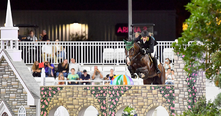 Equestrian Rowan Willis and horse jump at the World Equestrian Center Ocala