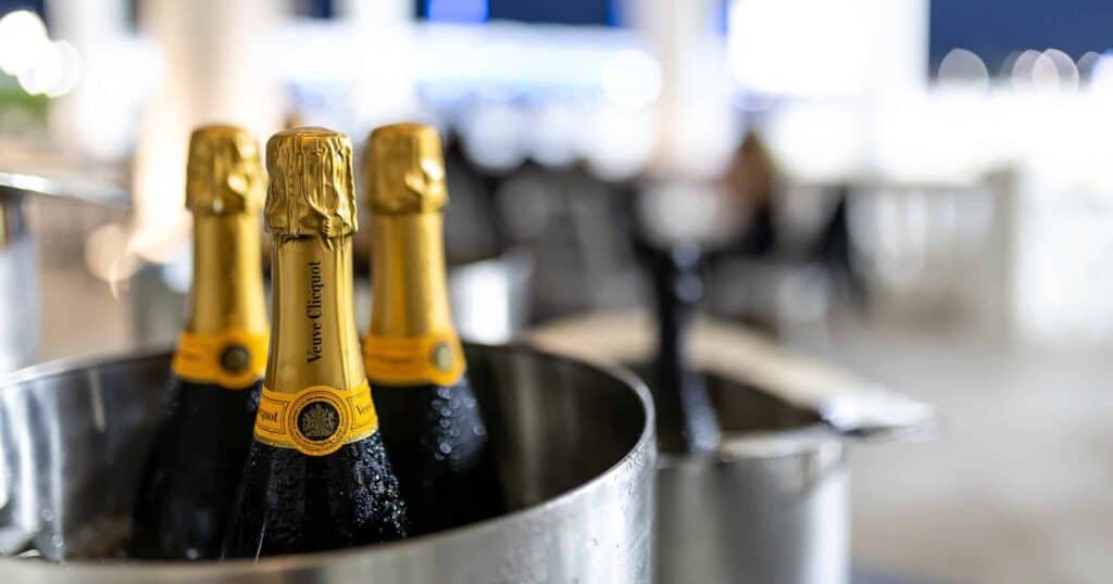 A bucket of Champagne bottles outside on the terrace