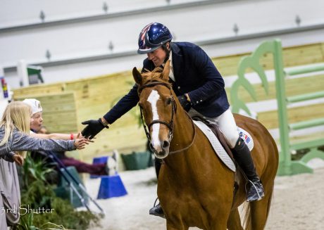 horse rider high fives horse show fans