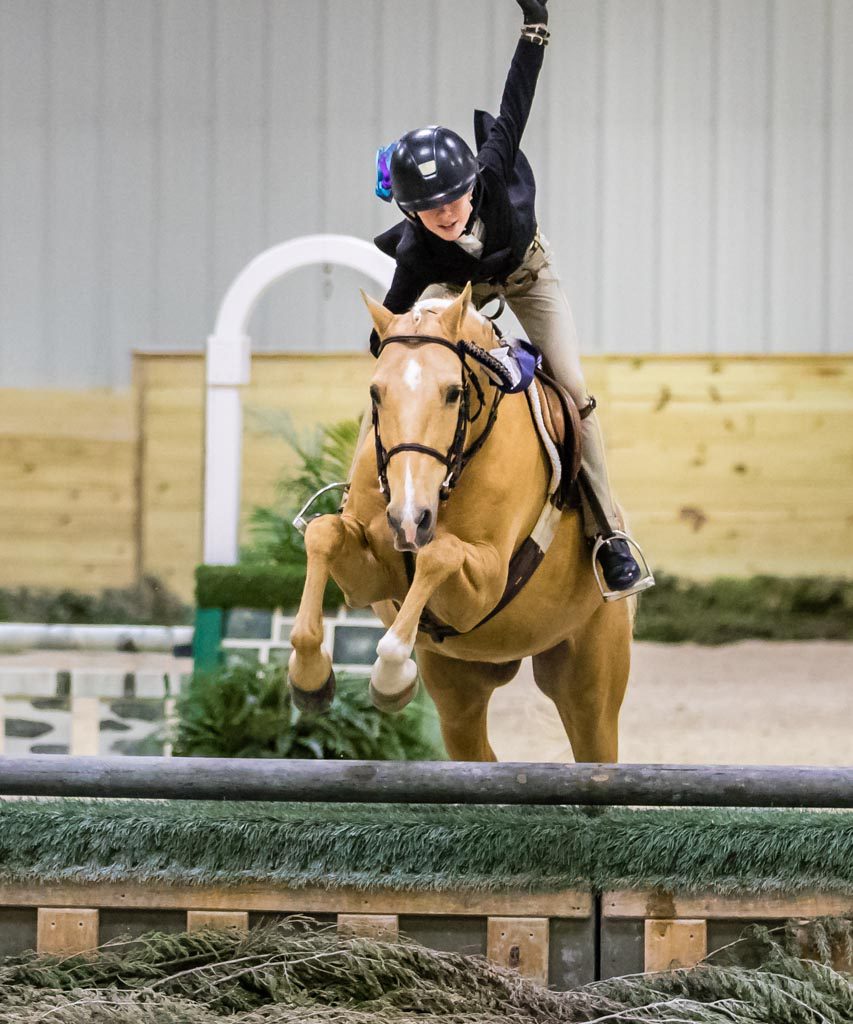 rider gives horse show fist pump