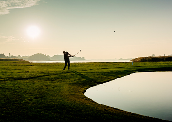 golden ocala gold and equestrian club golfer swinging sunset