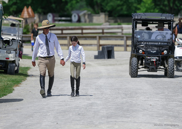 wilmington-equestrian-members-and-exhibitors child and adult walking up road