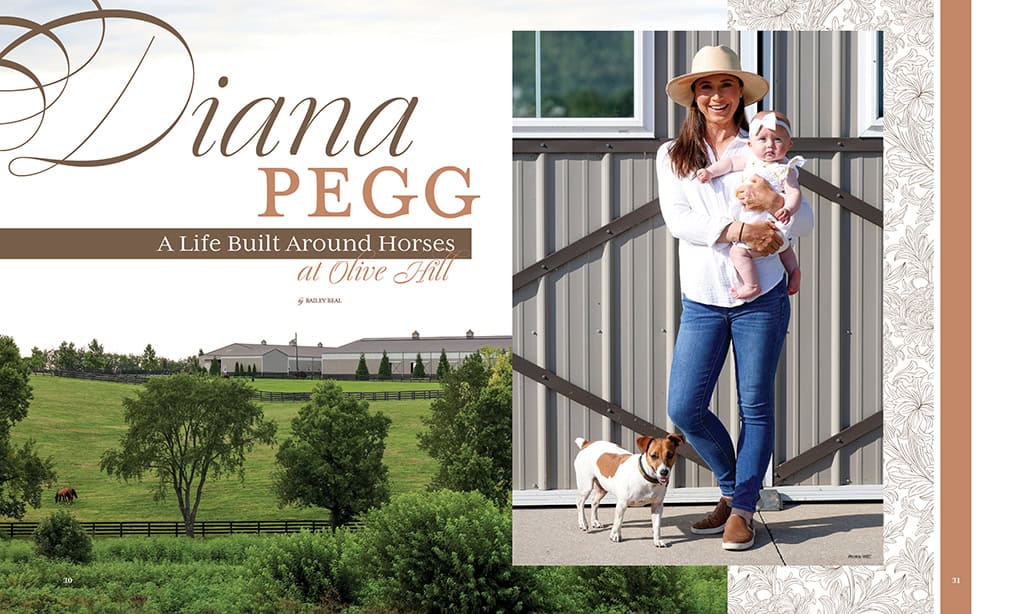 A woman holding a baby and a small dog stands outside a stable; nearby is a scenic horse farm with green fields and a fenced barn.