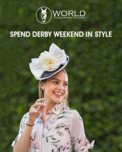 A woman in a floral blouse and decorative white hat smiles outdoors with 