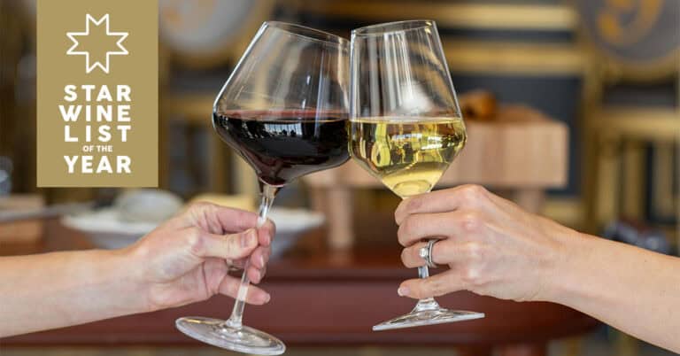Two hands clink wine glasses, one with red wine and one with white wine; a "Star Wine List of the Year" logo appears on the left.