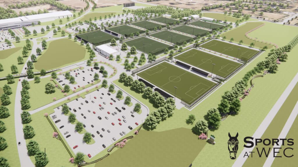 Aerial rendering of a large sports complex with multiple soccer fields, parking lots, surrounding trees, and the 