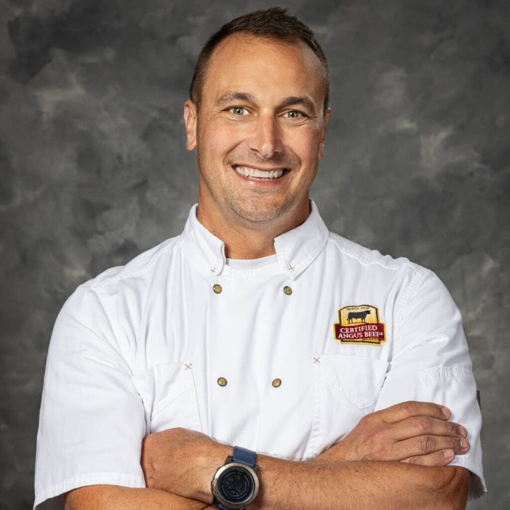 Man in a white chef's coat with a 