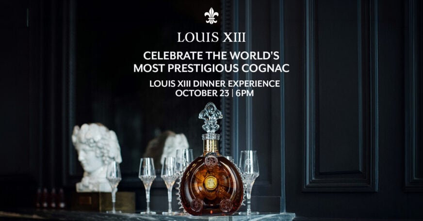 A bottle of Louis XIII cognac with four glasses is displayed on a table; event details for a Louis XIII Dinner Experience are written above.