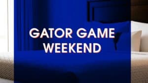 Text reading “GATOR GAME WEEKEND” overlaid on a blue-tinted image of a hotel bed.
