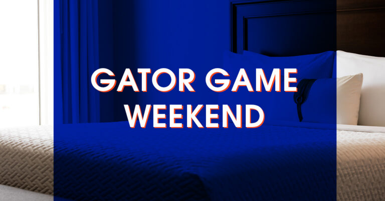 A neatly made bed in a hotel room with the words “Gator Game Weekend” overlaid in bold white text.